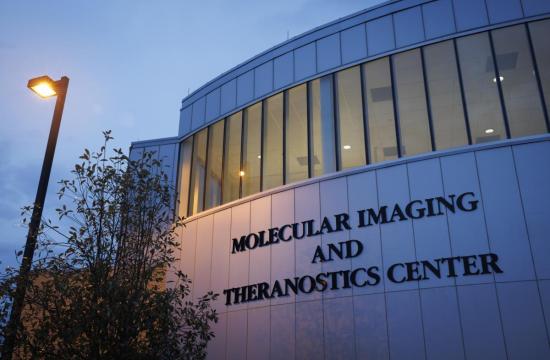 photo of the outside of the MITC building at twilight.